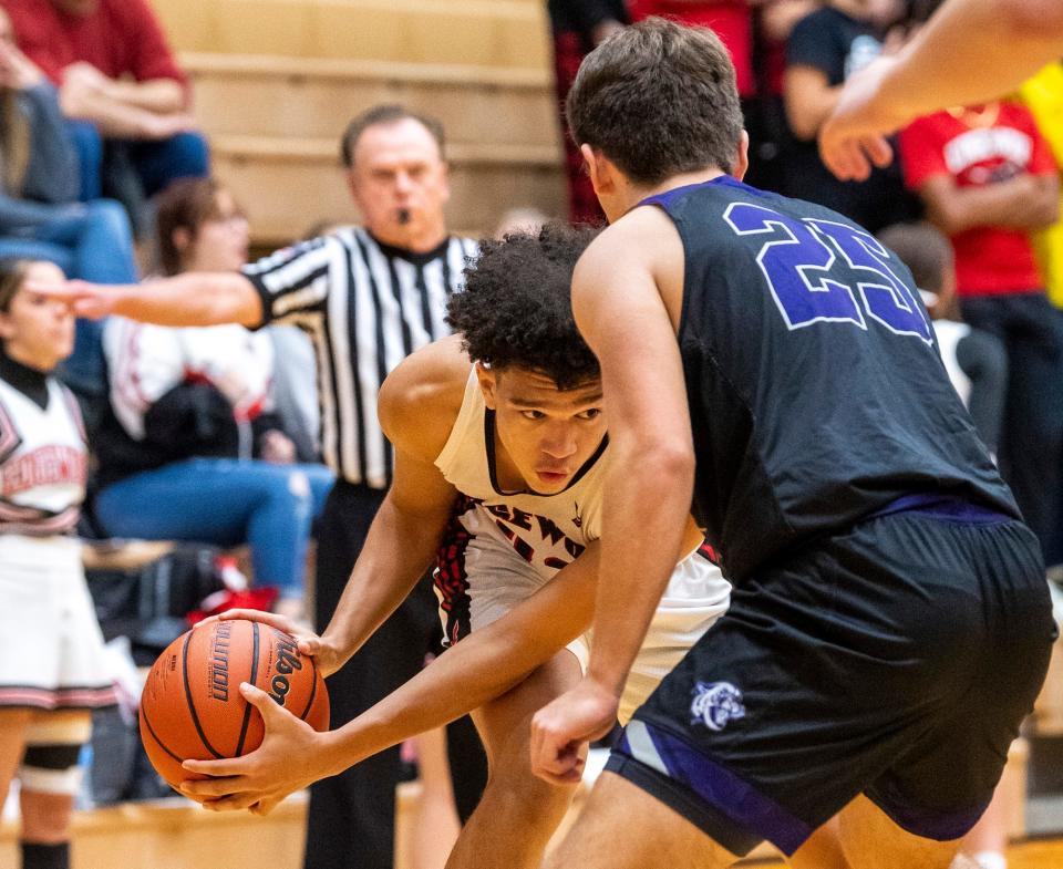 Edgewood's Mialin White (22) looks to get around Bloomington South's Zach David (25) during the Bloomington South versus Edgewood boys basketball gamet at Edgewood High School on Tuesday, Nov. 22, 2022.