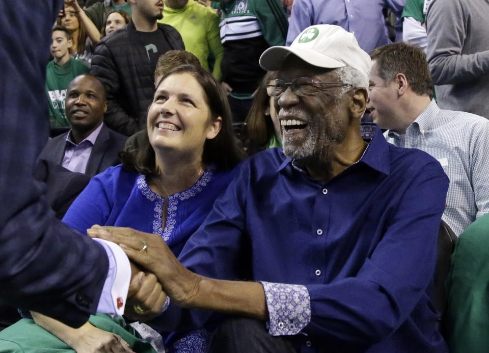 Boston Celtics legendary player Bill Russell is greeted at his seat before Game 1 of an NBA basketball second-round playoff series between the Boston Celtics and the Philadelphia 76ers, Monday, April 30, 2018, in Boston. (AP Photo)