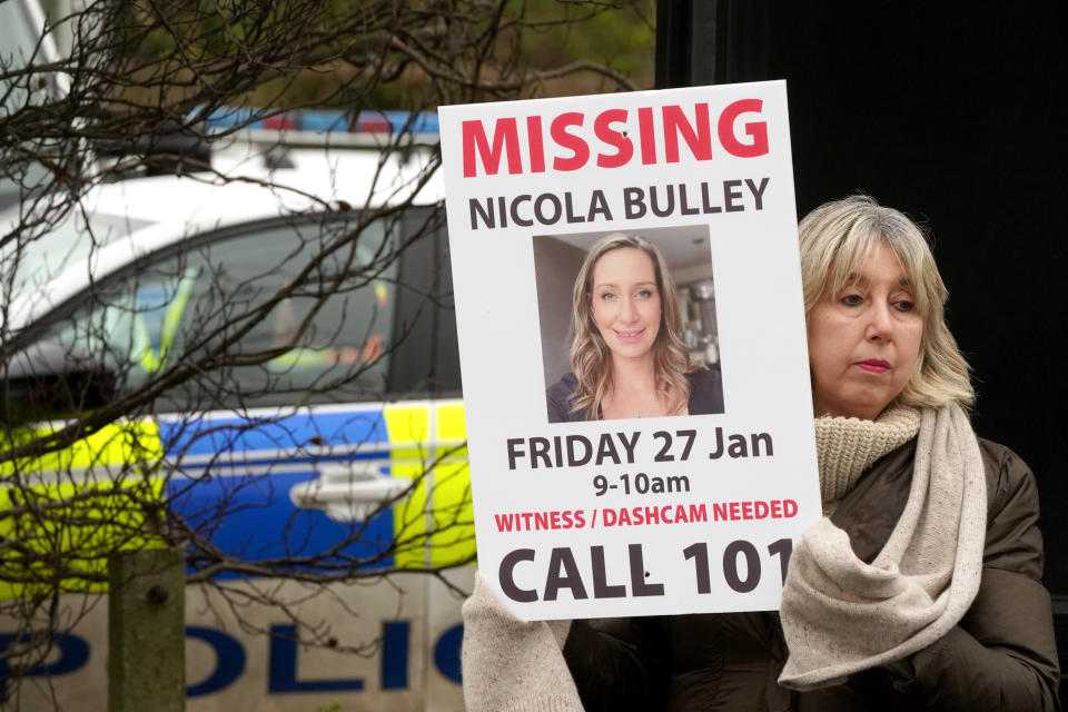 Friends of missing woman Nicola Bulley hold missing person appeal posters along the main road in the village in St Michael's on Wyre, Lancashire. Ms Bulley, 45, was last seen two weeks ago on the morning of Friday January 27, when she was spotted walking her dog on a footpath by the nearby River Wyre. Picture date: Friday February 10, 2023. (Photo by Owen Humphreys/PA Images via Getty Images)