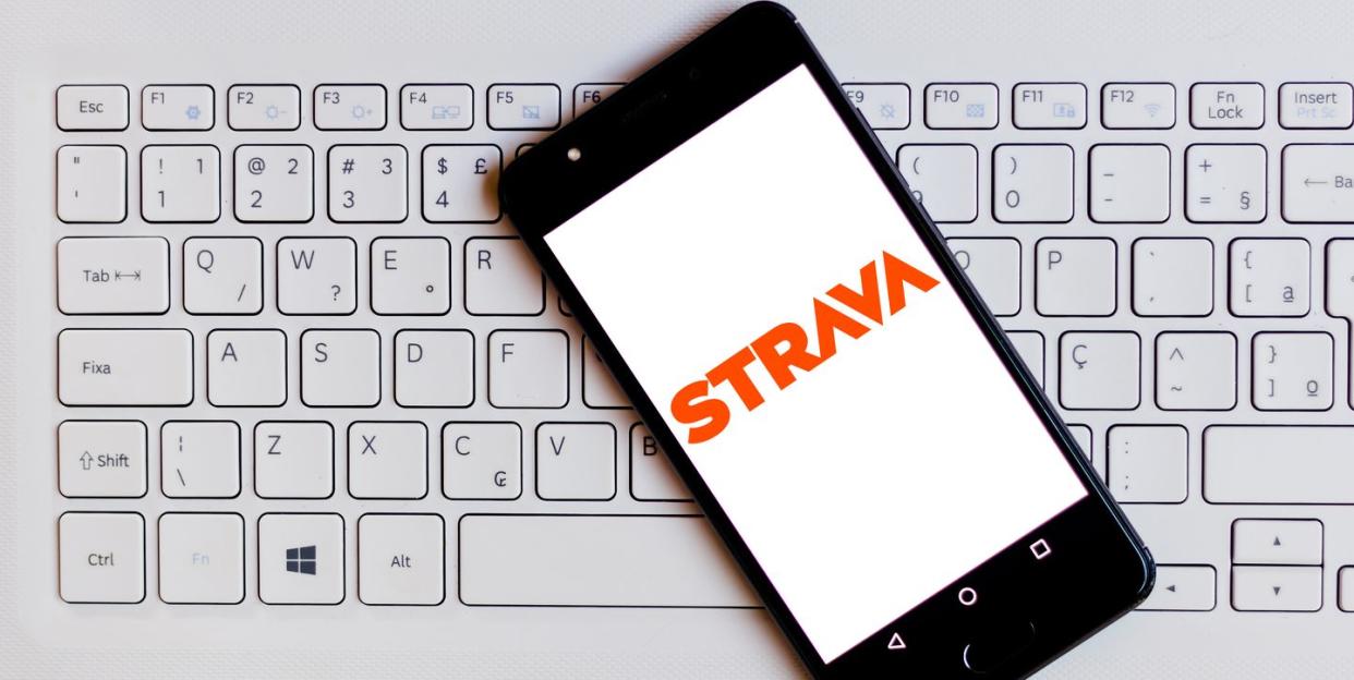 in this photo illustration the strava logo is seen displayed