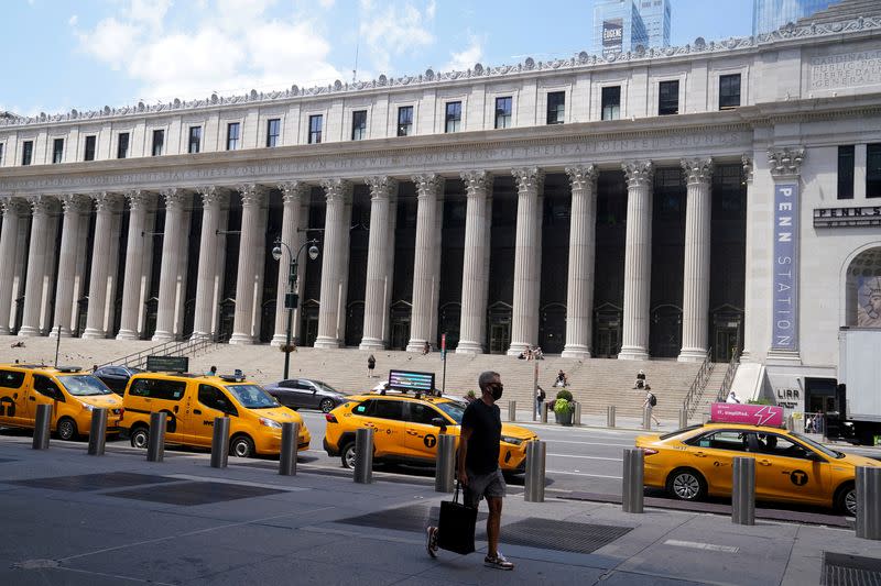 FILE PHOTO: Taxis are parked across the street from the U.S. Postal Service Farley building that Facebook announced it would lease for office space