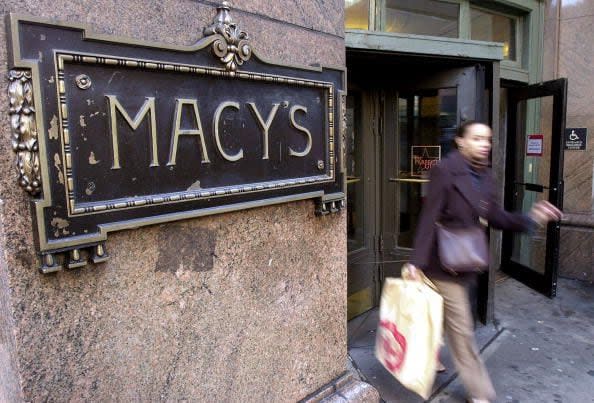 2000 A woman exits Macy''s department store on Sixth Avenue December 14, 2000 in New York.  (Photo by Chris Hondros/Newsmakers)