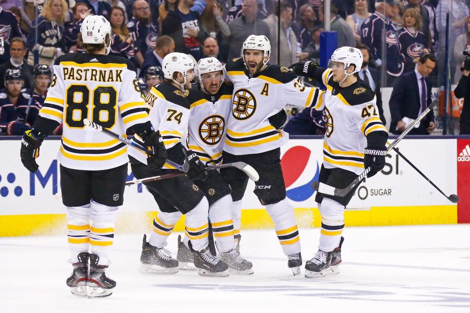 COLUMBUS, OH - MAY 2:  Patrice Bergeron #37 of the Boston Bruins is congratulated by his teammates after scoring a power play goal against the Columbus Blue Jackets during the first period in Game Four of the Eastern Conference Second Round during the 2019 NHL Stanley Cup Playoffs on May 2, 2019 at Nationwide Arena in Columbus, Ohio. (Photo by Kirk Irwin/Getty Images)