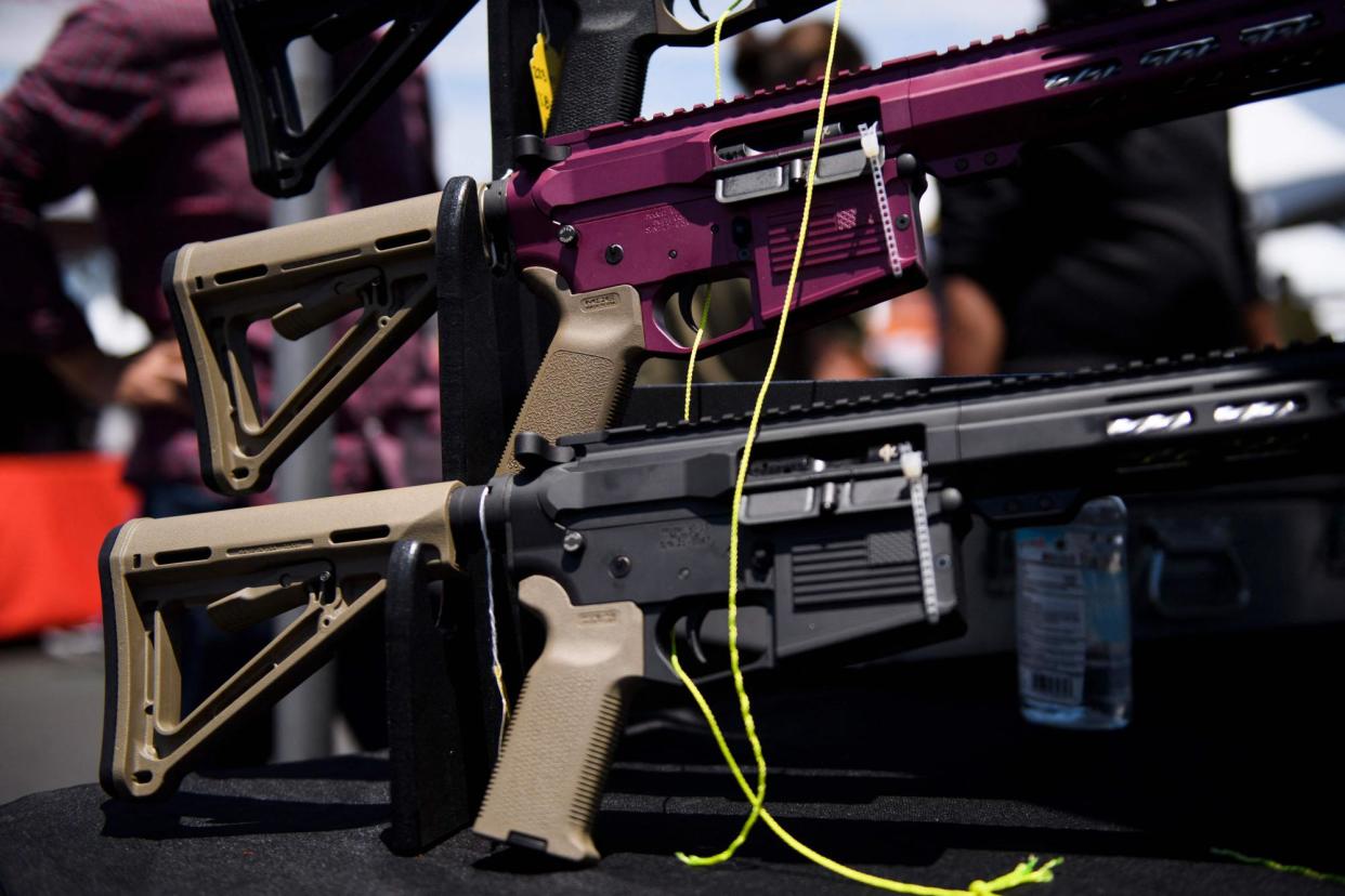 <span>AR-15 style rifles are displayed for sale at a gun show in Costa Mesa, California, in 2021.</span><span>Photograph: Patrick T Fallon/AFP/Getty Images</span>