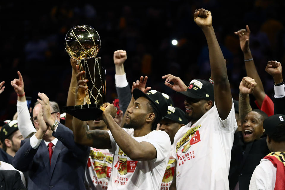 Kawhi Leonard #2 of the Toronto Raptors celebrates with the Larry O'Brien Championship Trophy after his team defeated the Golden State Warriors to win Game Six of the 2019 NBA Finals at ORACLE Arena on June 13, 2019 in Oakland, California. (Photo by Ezra Shaw/Getty Images)