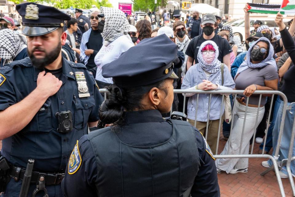 PHOTO: Police watch as pro-Palestinian supporters continue to demonstrate outside of an encampment on the campus of Columbia University on April 30, 2024 in New York City. (Spencer Platt/Getty Images)