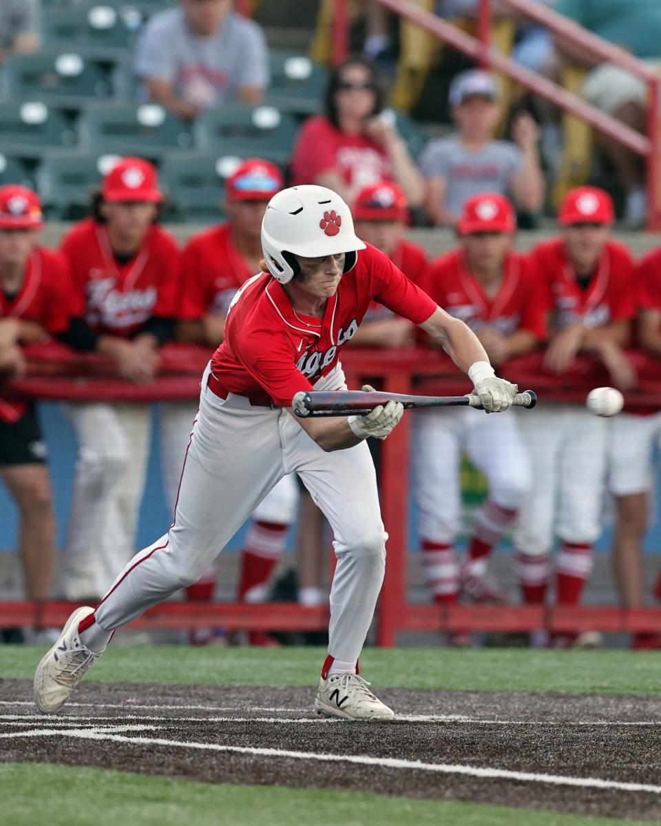 Beechwood batter Jackson Roseburrough, shown executing a perfect RBI suicide squeeze last year, hit a walk-off single to lift the Tigers to a win over Owensboro Catholic June 2.