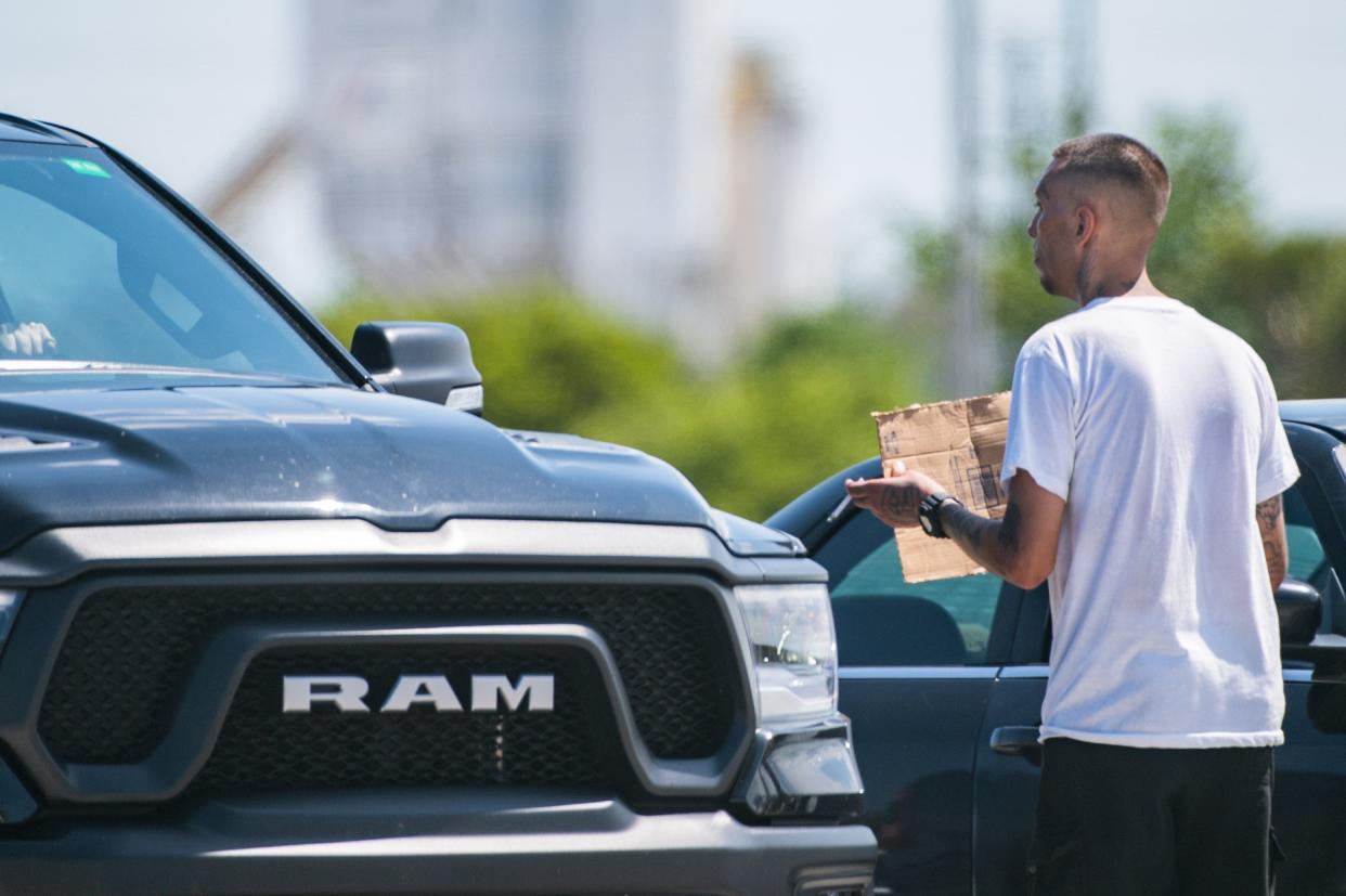 A panhandler on the northbound I-95 off-ramp at 10th Avenue North in Lake Worth Beach.