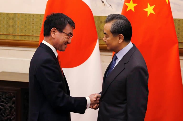 Japanese Foreign Minister Taro Kono (L) met Wang Yi when he visited Beijing in January