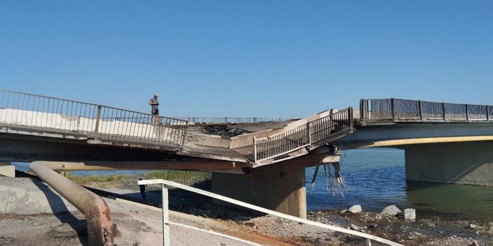 A side-on view of a cratered bridge in Crimea, as Ukraine announces a strike with a Storm Shadow missile on August 6, 2023