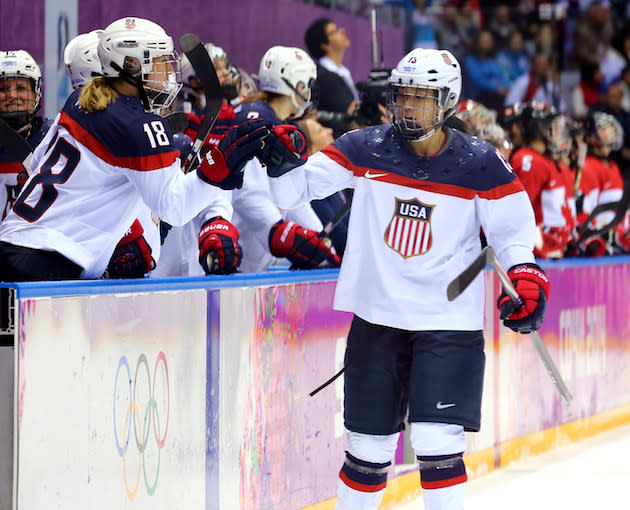 SOCHI, RUSSIA – FEBRUARY 20: Julie Chu #13 of the United States celebrates with teammates after Meghan Duggan #10 scored a second-period goal against Canada during the Ice Hockey Women’s Gold Medal Game on day 13 of the Sochi 2014 Winter Olympics at Bolshoy Ice Dome on February 20, 2014 in Sochi, Russia. (Photo by Martin Rose/Getty Images)