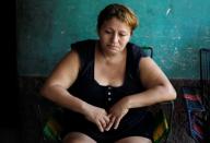 Mother of late Honduran migrant Herrera looks down at her home in El Limon