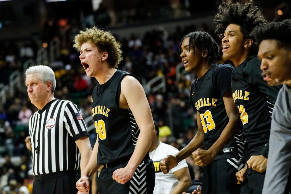 Ferndale foward Jayden Hardiman (20), wing Kaden Huston (33) and forward Mishawn Hereford (10) celebrate a play against Saginaw during the second half of MHSAA boys Division 2 semifinal at Breslin Center in East Lansing on Friday, March 24, 2023.