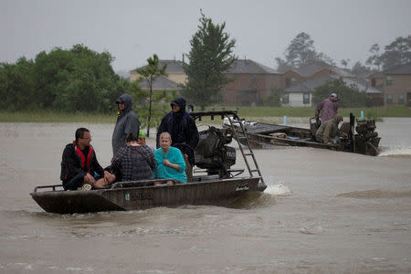 Residents are rescued by a boat from rising flood waters from Tropical Storm Harvey in east Houston, Texas, U.S. August 28, 2017. REUTERS/Adrees Latif
