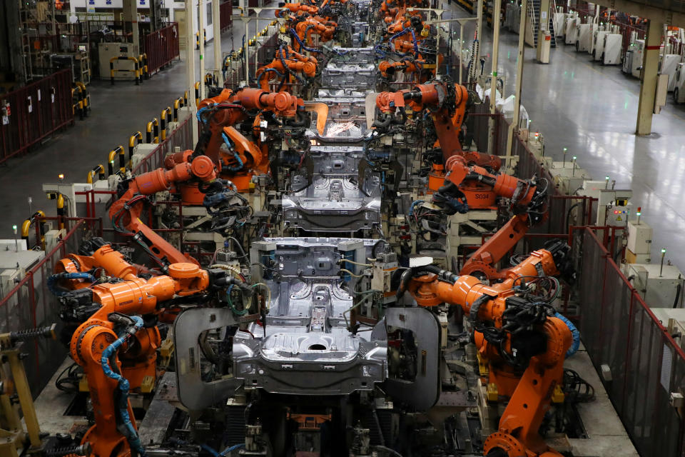 Robots weld bodyshells of car are pictured on the assembly line in the Proton manufacturing plant in Tanjung Malim, Malaysia, December 16, 2019. Picture taken December 16, 2019. REUTERS/Lim Huey Teng