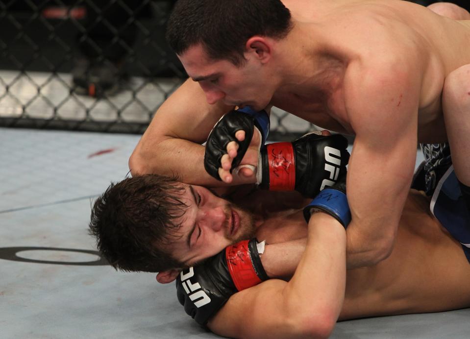 Roland Delorme (top) throws an elbow down on Josh Ferguson during The Ultimate Fighter 14 Finale at the Pearl Theatre at the Palms Hotel and Casino on December 3, 2011 in Las Vegas, Nevada. (Photo by Josh Hedges/Zuffa LLC/Zuffa LLC via Getty Images)