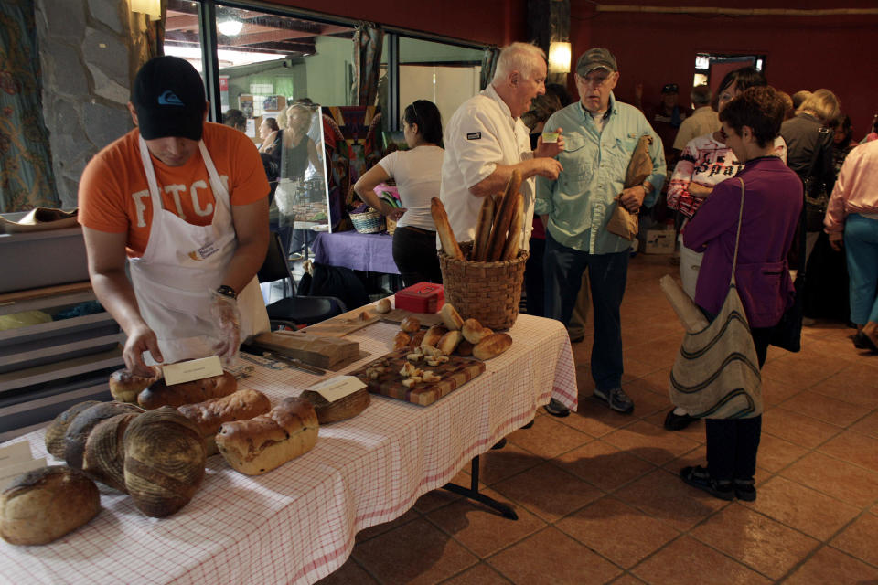 This May 28, 2013 photo shows retired Americans gathering in a market in Boquete, west of Panama City, Panama. Panama has become a hot spot for American retirees. They come for the natural beauty, the weather and, perhaps more important, the low cost of living. (AP Photo/Arnulfo Franco)