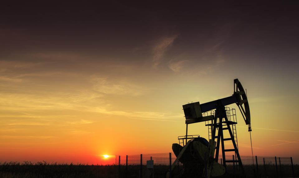 An shale oil pump at sunset.