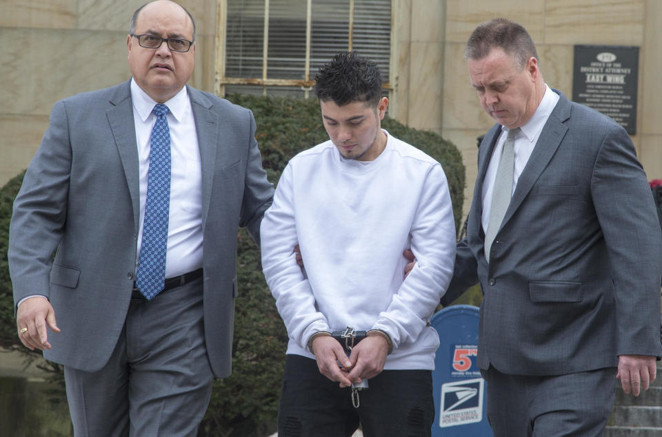 MS-13 gang leader Victor Lopez is led out of the Nassau County District Attorney's office in Mineola, New York on January 11, 2018.  / Credit: Newsday/Newsday RM via Getty Images