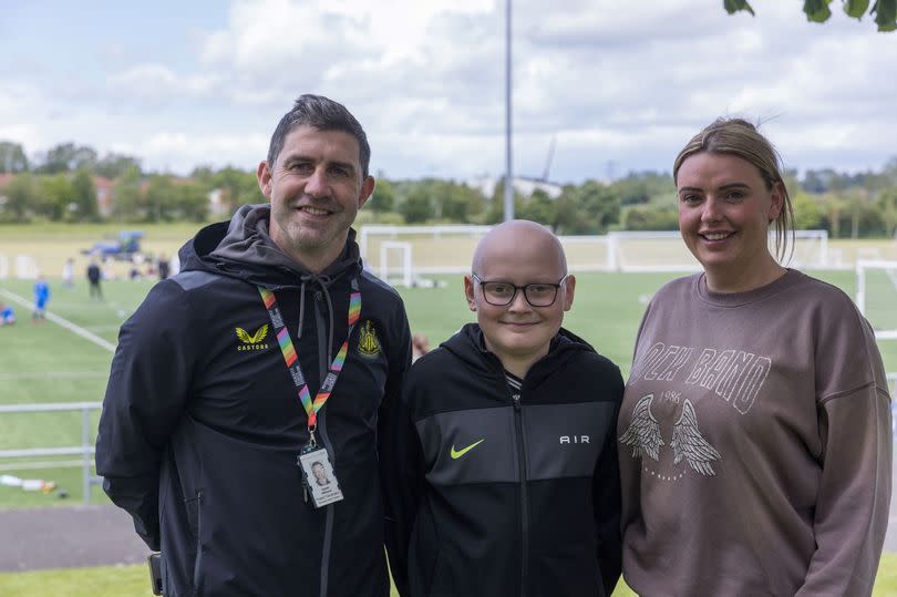 Ethan O'Neill with mum Lisa Jane and Gareth Williams who runs a children's support service for poorly youngsters at the Great North Children's Hospital