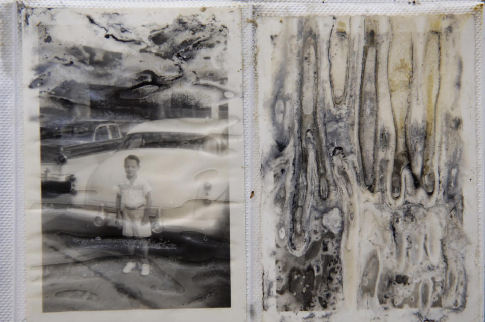 ‘Personal photo albums lay strewn among the wreckage of their former lives’
