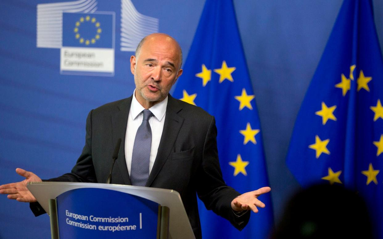 European Commissioner for Economic and Financial Affairs Pierre Moscovici speaks during a media conference at EU headquarters in Brussels, Monday, Aug. 20, 2018 - AP