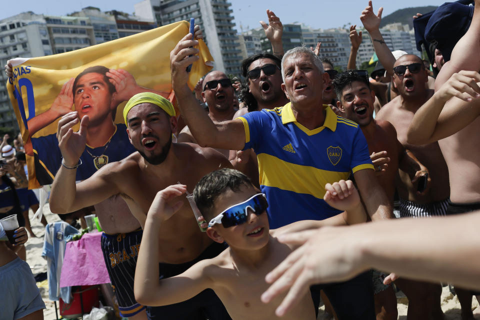 Argentine Boca Juniors fans gather on Copacabana beach the day before their team faces Brazil's Fluminense at the Copa Libertadores championship match in Rio de Janeiro, Brazil, Friday, Nov. 3, 2023. (AP Photo/Bruna Prado)