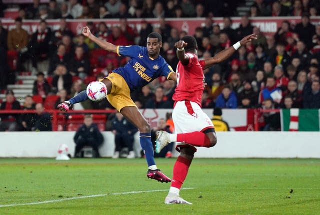 Alexander Isak, left, scores his first goal