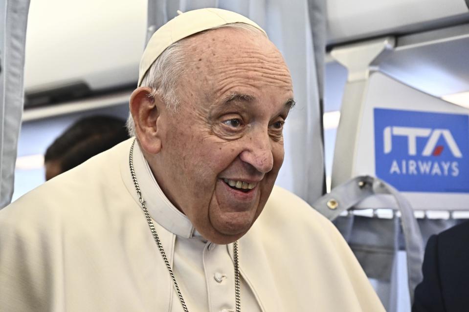 Pope Francis meets the journalists aboard of the flight to Budapest, on the occasion of a three-day pastoral visit to Hungary, Friday, April 28, 2023. (Luca Zennaro/Pool ANSA via AP)