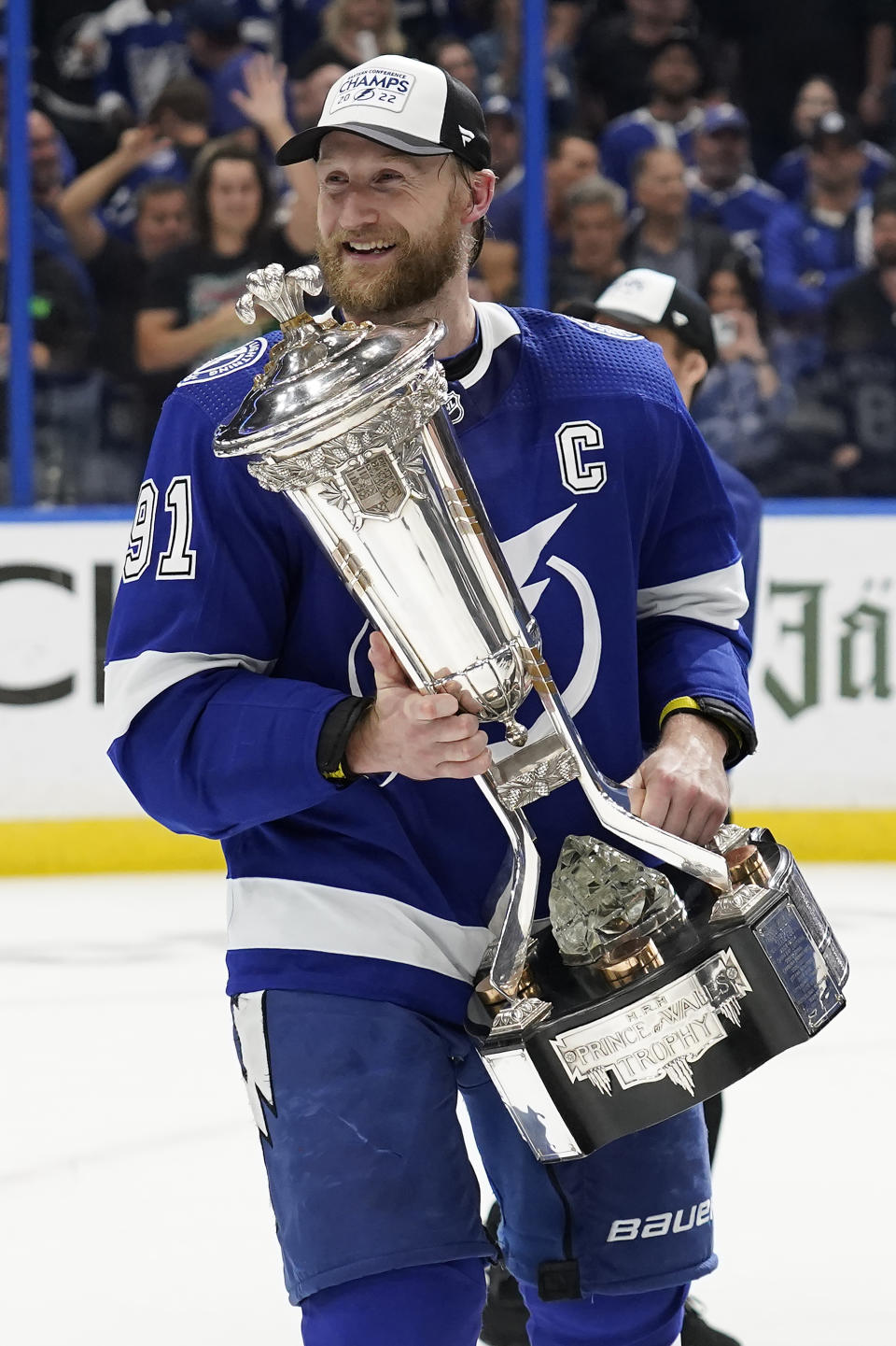 Tampa Bay Lightning center Steven Stamkos holds the Prince of Wales Trophy after defeating the New York Rangers during Game 6 of the NHL hockey Stanley Cup playoffs Eastern Conference finals Saturday, June 11, 2022, in Tampa, Fla. The Lightning advanced to the Stanley Cup Finals. (AP Photo/Chris O'Meara)