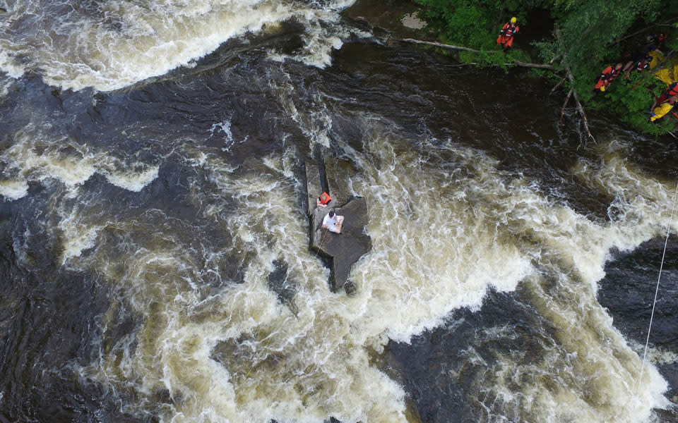 Auburn Fire Department uses a drone to feed a haul line and a life jacket