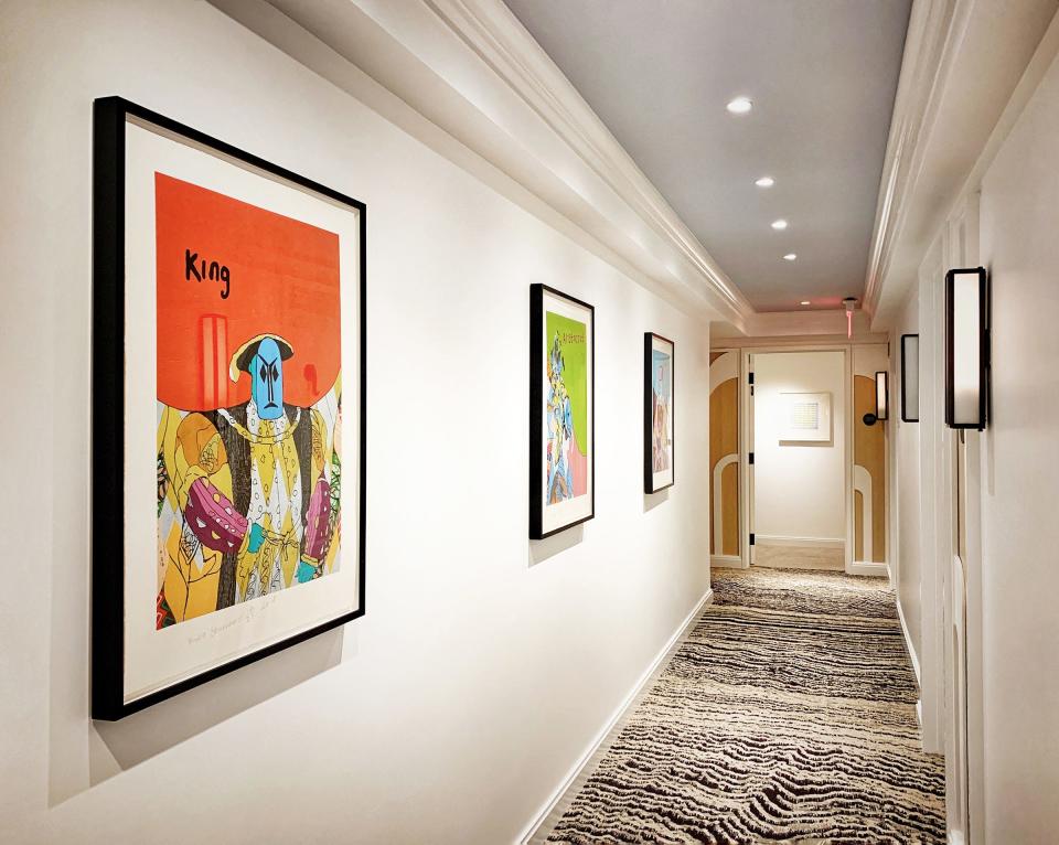 A series of paintings by Yinka Shonibare lines a second-floor corridor at the hotel