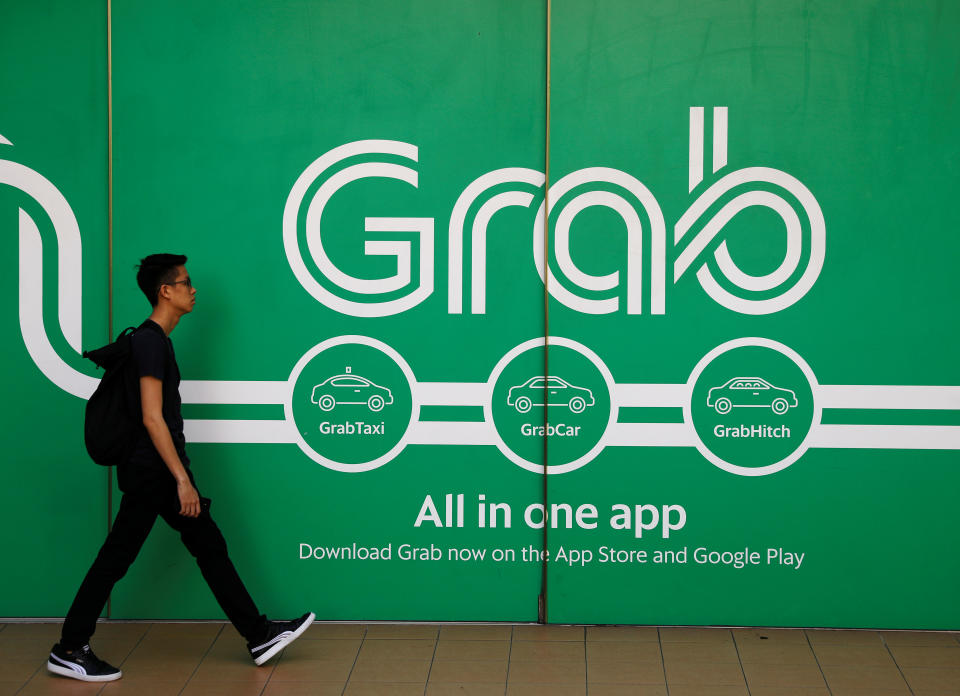 A man walking past Grab office in Singapore