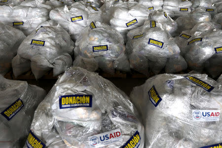 Humanitarian aid for Venezuela, with a sticker that reads "Donation, prohibited its sale", is seen in a warehouse on the Tienditas cross-border bridge between Colombia and Venezuela in Cucuta, Colombia, February 18, 2019. REUTERS/Luisa Gonzalez