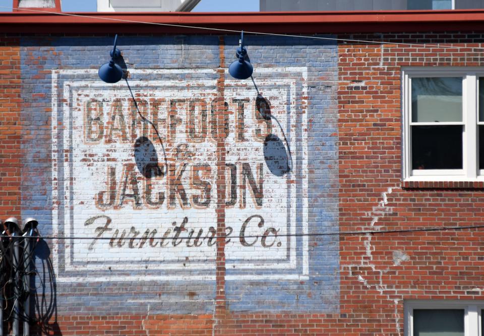 "Barefoots & Jackson Furniture Co." is painted onto the back of the building at 21 S. Front St. in downtown Wilmington.   [MATT BORN/STARNEWS]