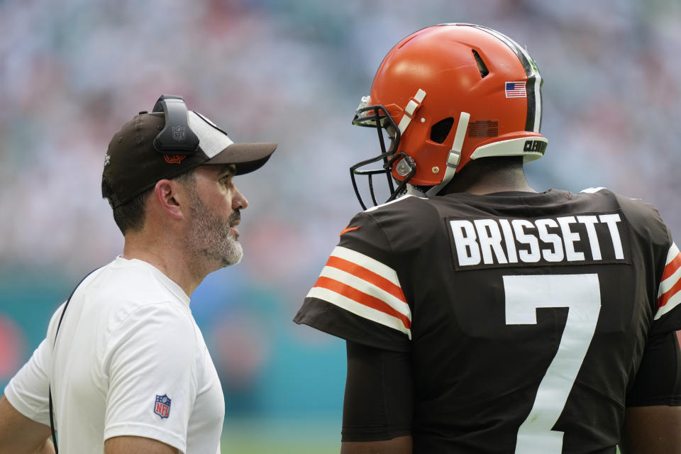 Cleveland Browns head coach Kevin Stefanski talks to quarterback Jacoby Brissett (7) during the first half of an NFL football game against the Miami Dolphins, Sunday, Nov. 13, 2022, in Miami Gardens, Fla. (AP Photo/Lynne Sladky)