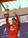 Ferrari driver Charles Leclerc of Monaco lifts the trophy after finishing first in the Belgian Formula One Grand Prix in Spa-Francorchamps, Belgium, Sunday, Sept. 1, 2019. Mercedes driver Lewis Hamilton of Britain placed second and Mercedes driver Valtteri Bottas of Finland placed third. (AP Photo/Francisco Seco)