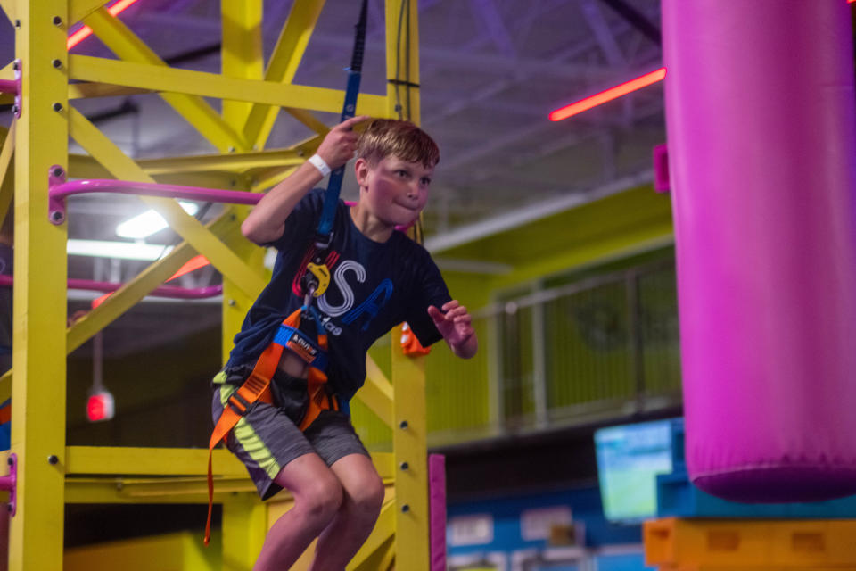 A young boy prepares to take a leap of faith at Urban Air Adventure Park in Amarillo.