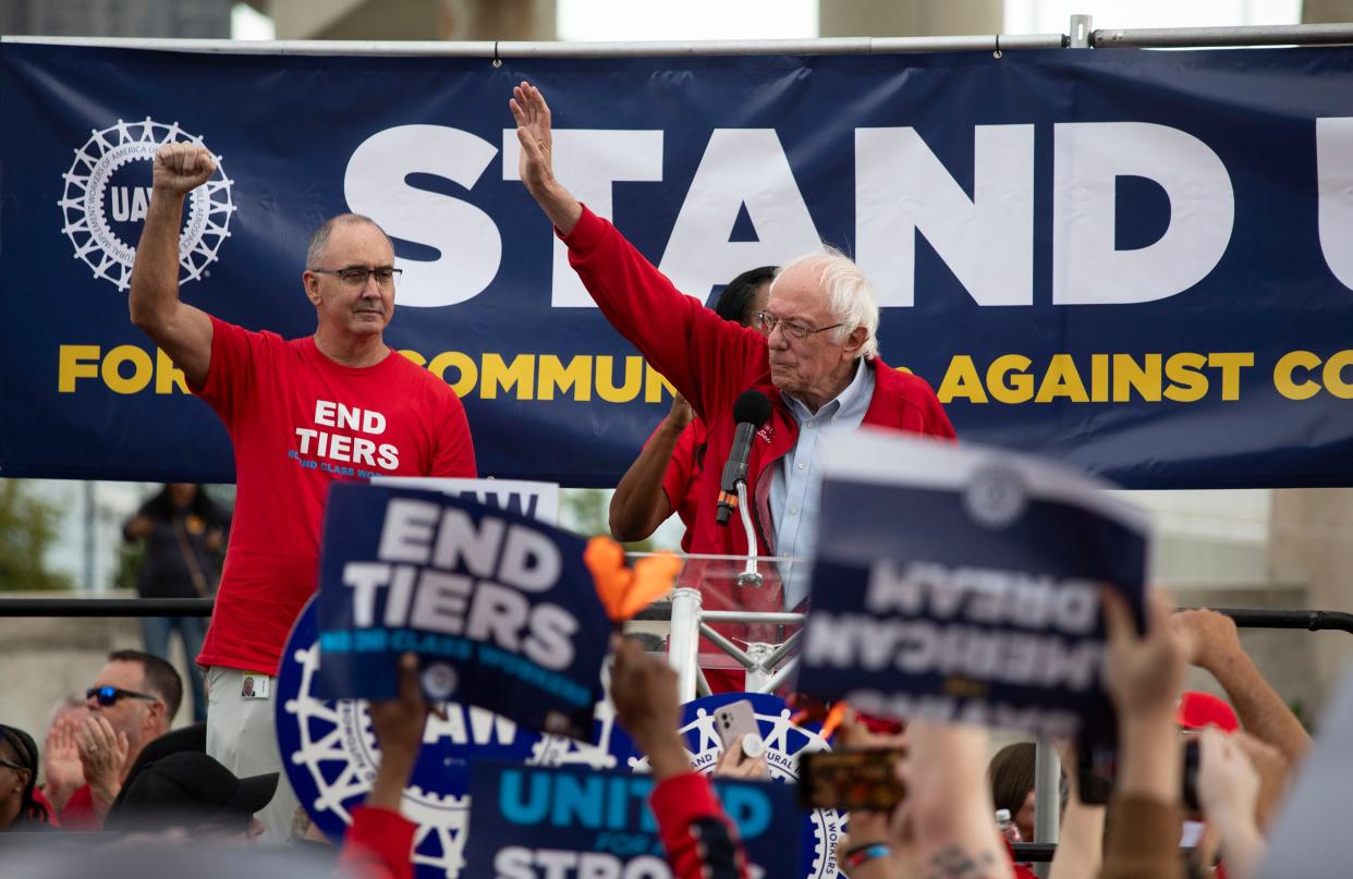 Sen Bernie Sanders, I-Vt., and UAW President Shawn Fain (L) speak at a rally in support of United Auto Workers members as they strike the Big Three auto makers on September 15, 2023 in Detroit, Michigan.