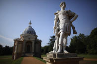 A statue stands next to the Archer pavillion in the grounds at Wrest Park. 