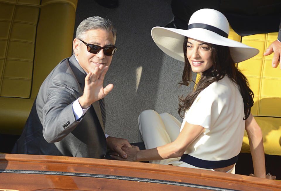 George Clooney and Amal Alamuddin leave the city hall after their civil marriage ceremony in Venice, Italy, Monday, Sept. 29, 2014. George Clooney married human rights lawyer Amal Alamuddin Saturday, the actor's representative said, out of sight of pursuing paparazzi and adoring crowds.&nbsp;