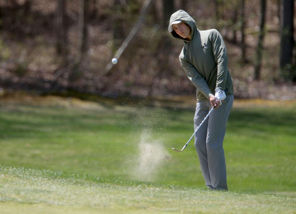 Colts Neck's Ethan Weinberg chips up to the 13th green during the Monmouth County Tournament boys golf at Howell Park Wednesday, April 19, 2023.