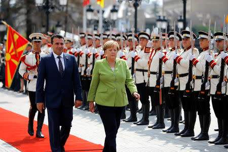 Macedonian Prime Minister Zoran Zaev and German Chancellor Angela Merkel attend a welcome ceremony in Skopje, Macedonia September 8, 2018. REUTERS/Ognen Teofilovski