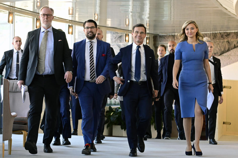 FILE - Johan Pehrson, leader of the Liberal Party, Jimmie Akesson, leader of the Sweden Democrats Party, Ulf Kristersson, leader of the Moderate Party and Ebba Busch, leader of the Christian Democrats arrive for a press conference regarding the formation of the government, at the Parliament in Stockholm, on Oct. 14, 2022. Sweden holds the powerful presidency of the European Union for the next six months, but there are concerns in the 27-nation bloc that the strong influence of the hard-line far right at home will hold them back. (Jonas Ekstromer/TT News Agency via AP, File)