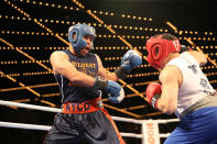 <p>Javier Colon, left, fights off Eddie Bermudez during the NYPD Boxing Championships at the Theater at Madison Square Garden on June 8, 2017. (Photo: Gordon Donovan/Yahoo News) </p>