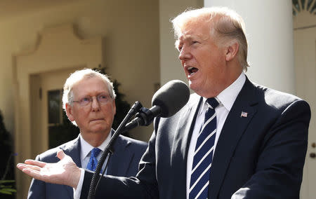 U.S. President Donald Trump speaks to the media with U.S. Senate Majority Leader Mitch McConnell at his side in the Rose Garden of the White House in Washington, U.S., October 16, 2017. REUTERS/Kevin Lamarque