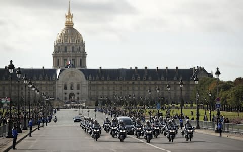 French police on motorcycles escort the funeral procession of French former President Jacques Chirac from the Invalides to the Church of Saint Sulpice in Paris - Credit: YOAN VALAT/EPA-EFE/REX&nbsp;