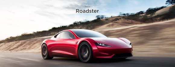A red Tesla Roadster sports car