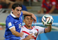 Costa Rica's Oscar Duarte (R) fights for the ball against Greece's Lazaros Christodoulopoulos during their 2014 World Cup round of 16 game at the Pernambuco arena in Recife June 29, 2014. REUTERS/Yves Herman