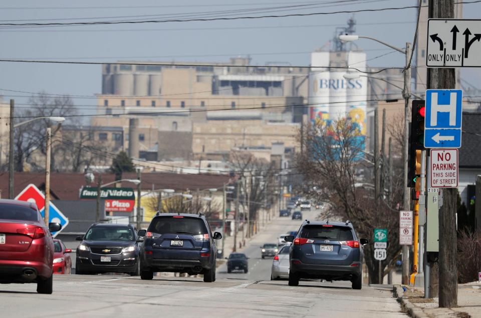 Traffic flows on Washington Street, Tuesday, April 12, 2022, in Manitowoc, Wis. There are plans to rebuild the well-traveled road.
